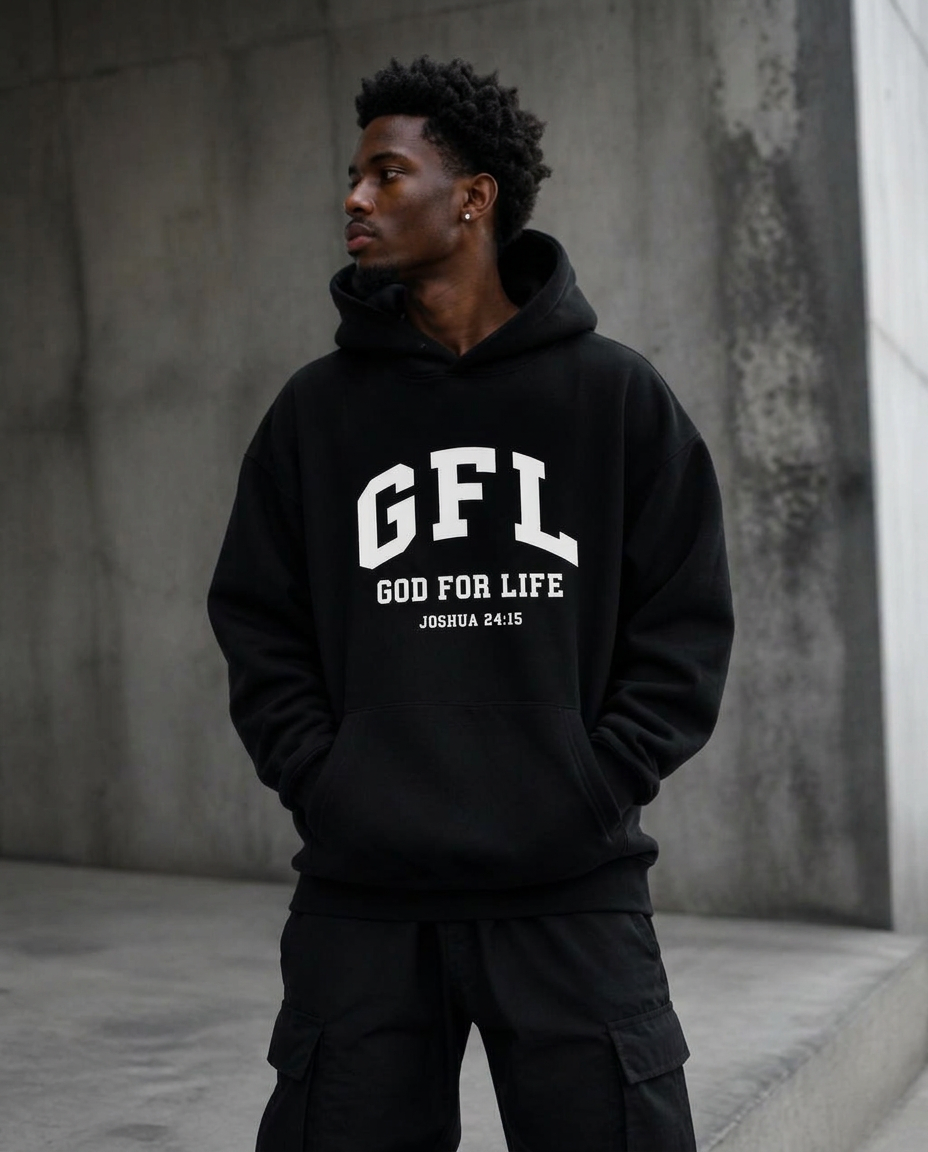Man in an oversized black God for Life hoodie