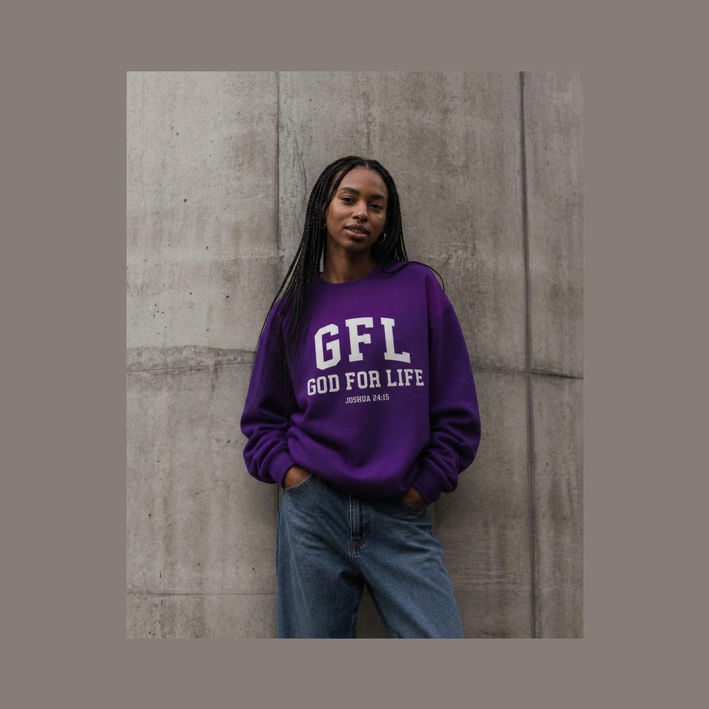 Woman with braids wearing a royal purple God for Life crewneck