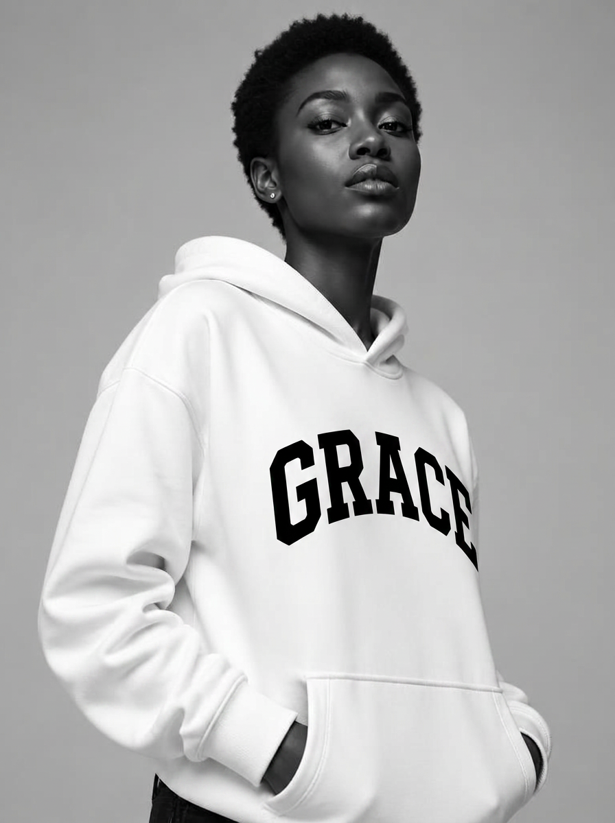 Woman with short hair in white Grace hoodie